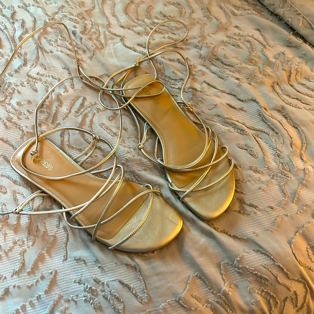 Express brand gold gladiator sandals. Size 7.